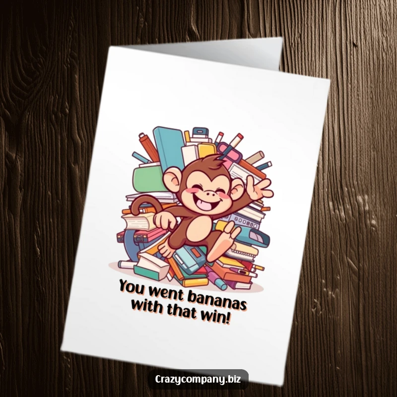 Funny Free Printable Congratulations Card: A cheeky monkey jumping amidst a pile of giant office supplies.